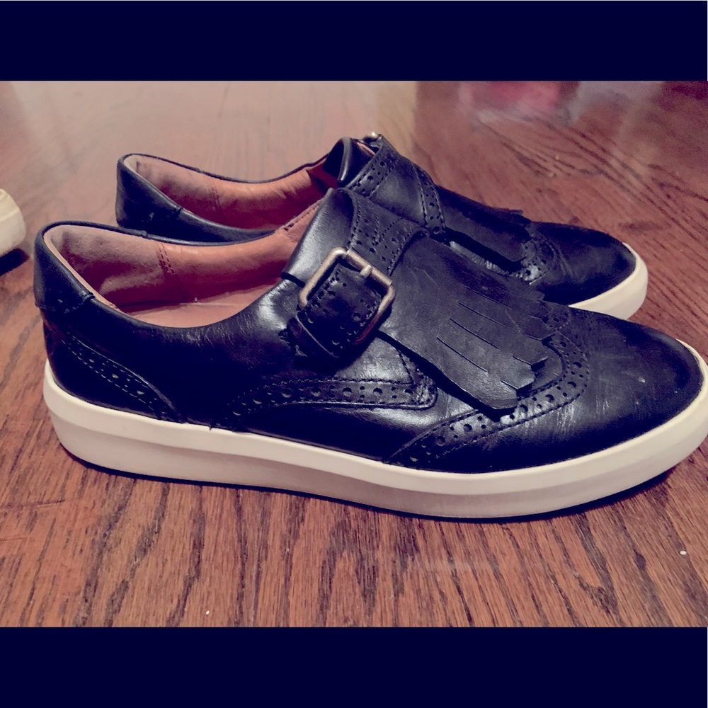 Black Leather FRYE sneaker with fringe on toe. Size 9. Great condition.